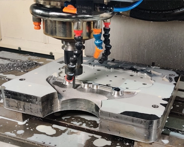 CNC machine cutting a metal component