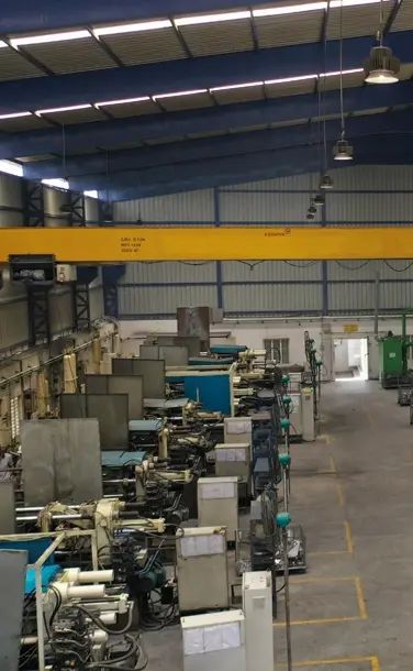 Industrial factory interior with machinery and overhead crane